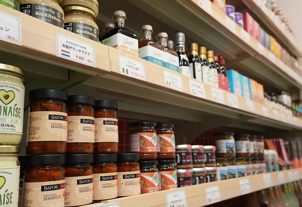 Shelves stocked with imported gourmet foods and wines at Felion
